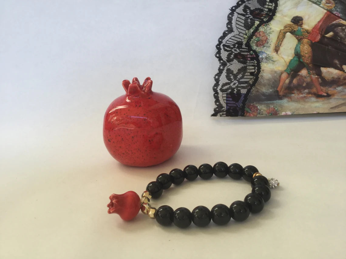 The "Carmen" Bracelet, Handmade Ceramic Pomegranate, Black Jasper Beads, and Gold Pave' beads.